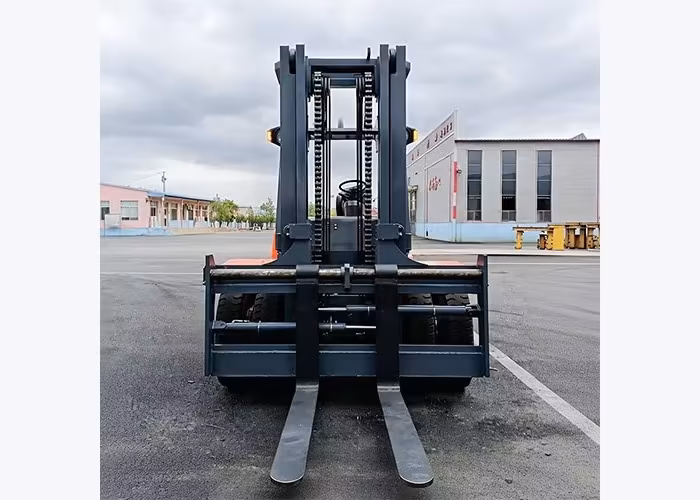 Counterbalance diesel forklift handling a large outdoor pallet load