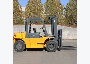 Diesel forklift positioned before a ramp route for slope and dock-plate safety review