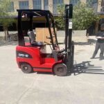 Diesel forklift positioned for mast selection review before container and yard work
