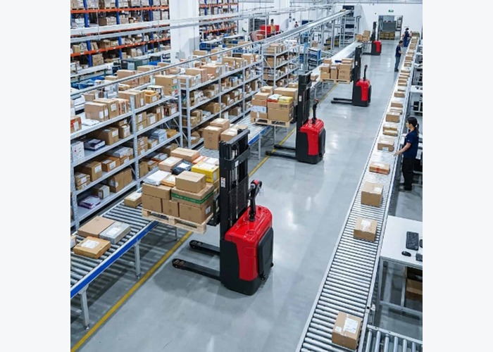 Electric pallet stacker parked after shared-aisle safety checks are complete