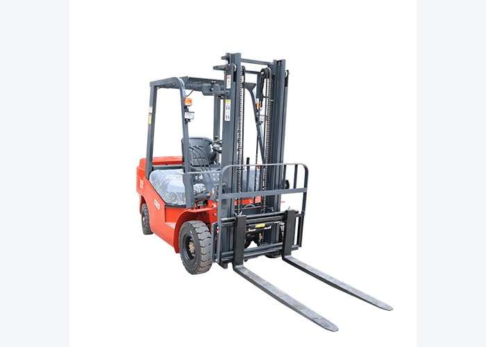 Electric forklift working near a warehouse charging area and pallet staging lane